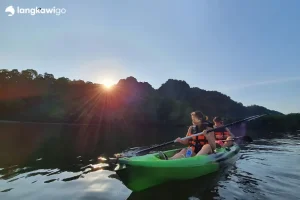 Mangrove Kayaking Tour Langkawi | RM120 Per Person 2026 Promo Kayakers on the river at sunset, Kilim