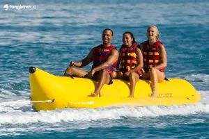 Three riders on a yellow banana boat, Langkawi