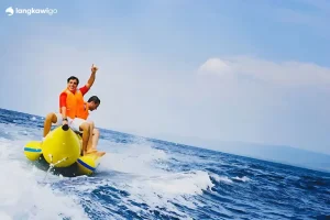 Banana boat lifting over a wave, Langkawi